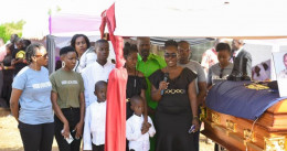 Family of slain police officer Barack Otieno during his burial.